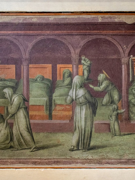 Hospital scene painting in Gallerie dell'Accademia, Venice, depicting caregivers attending to patients.