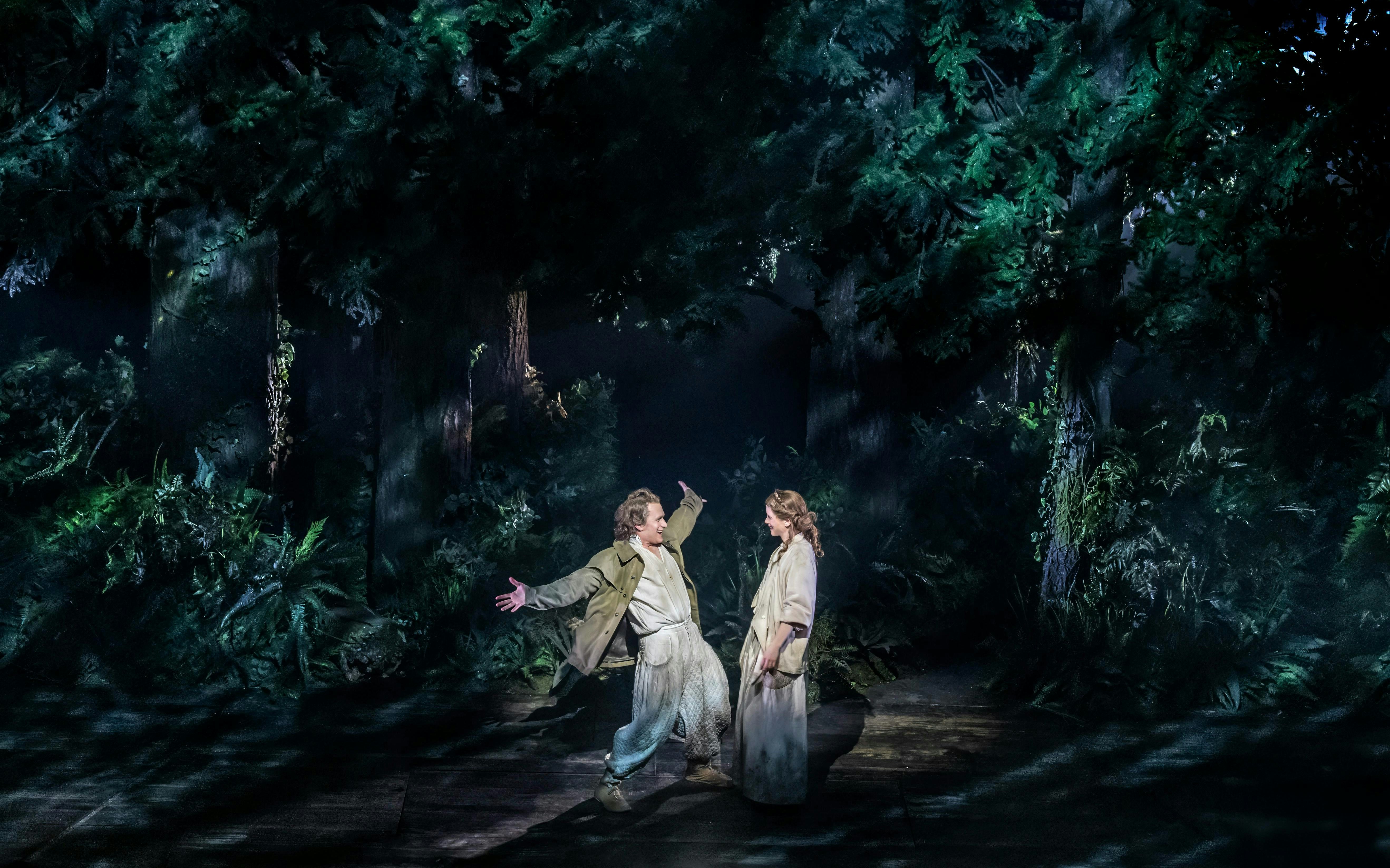 Actors performing in a forest scene from "Into The Woods" production.