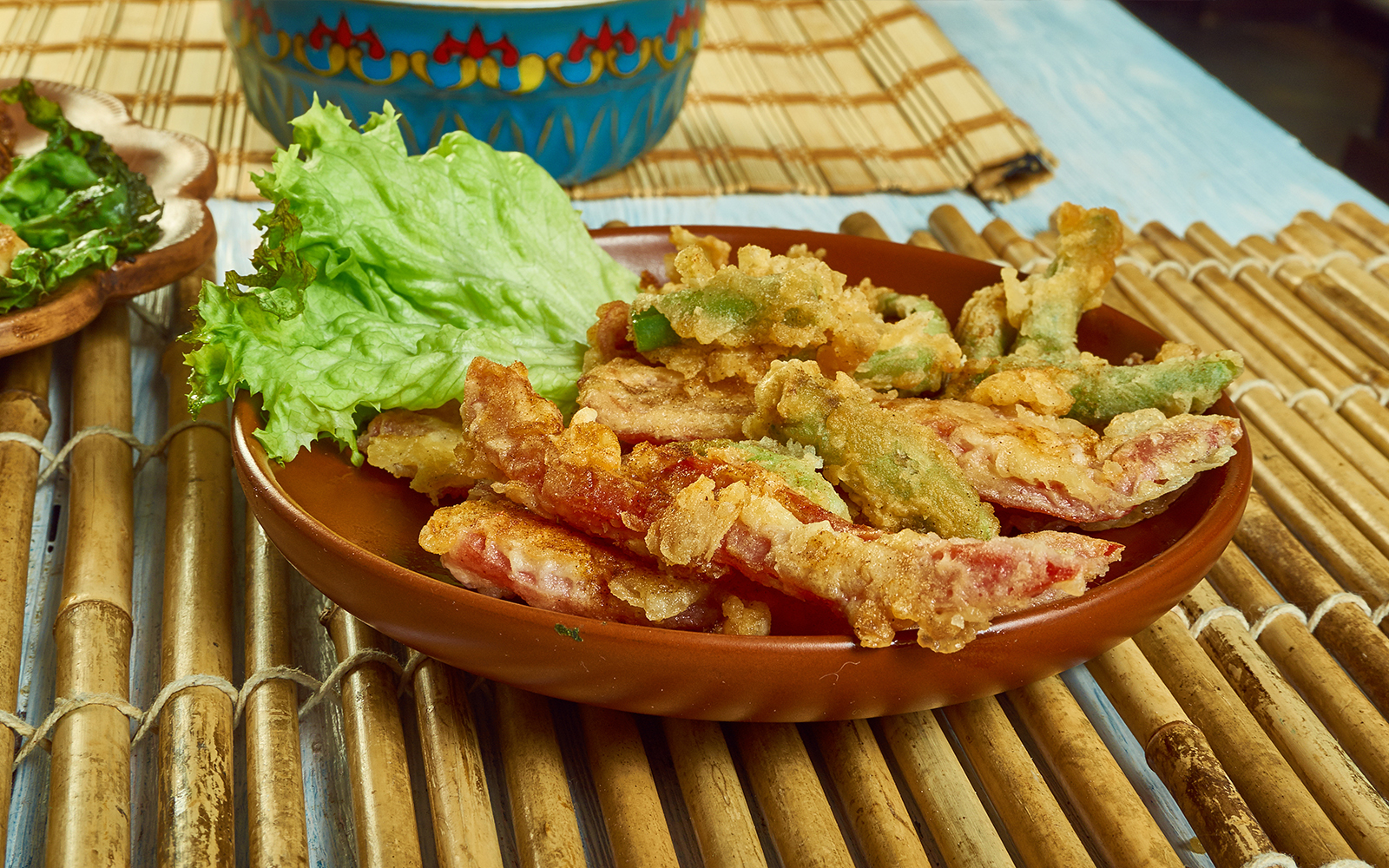 Portuguese Peixinhos da horta on a plate with lettuce, showcasing traditional fried green beans.