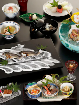 Traditional Kyoto kaiseki meal with assorted dishes and fresh ingredients.