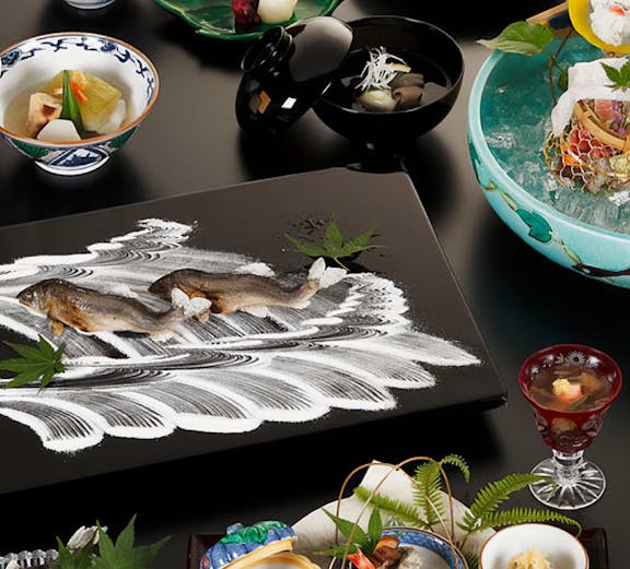 Traditional Kyoto kaiseki meal with assorted dishes and fresh ingredients.