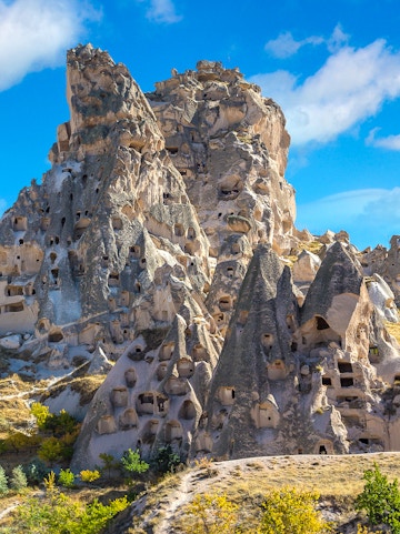 Rock formations with carved caves at Goreme Open Air Museum, Cappadocia, Turkey.