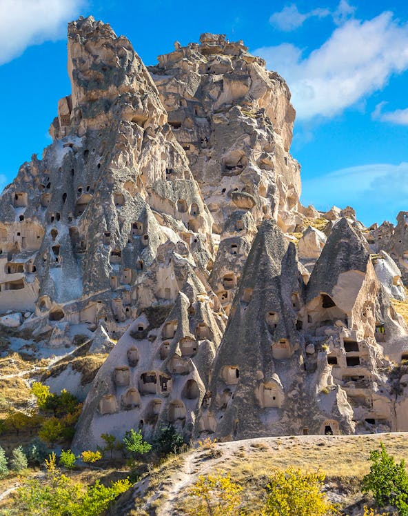 Rock formations with carved caves at Goreme Open Air Museum, Cappadocia, Turkey.