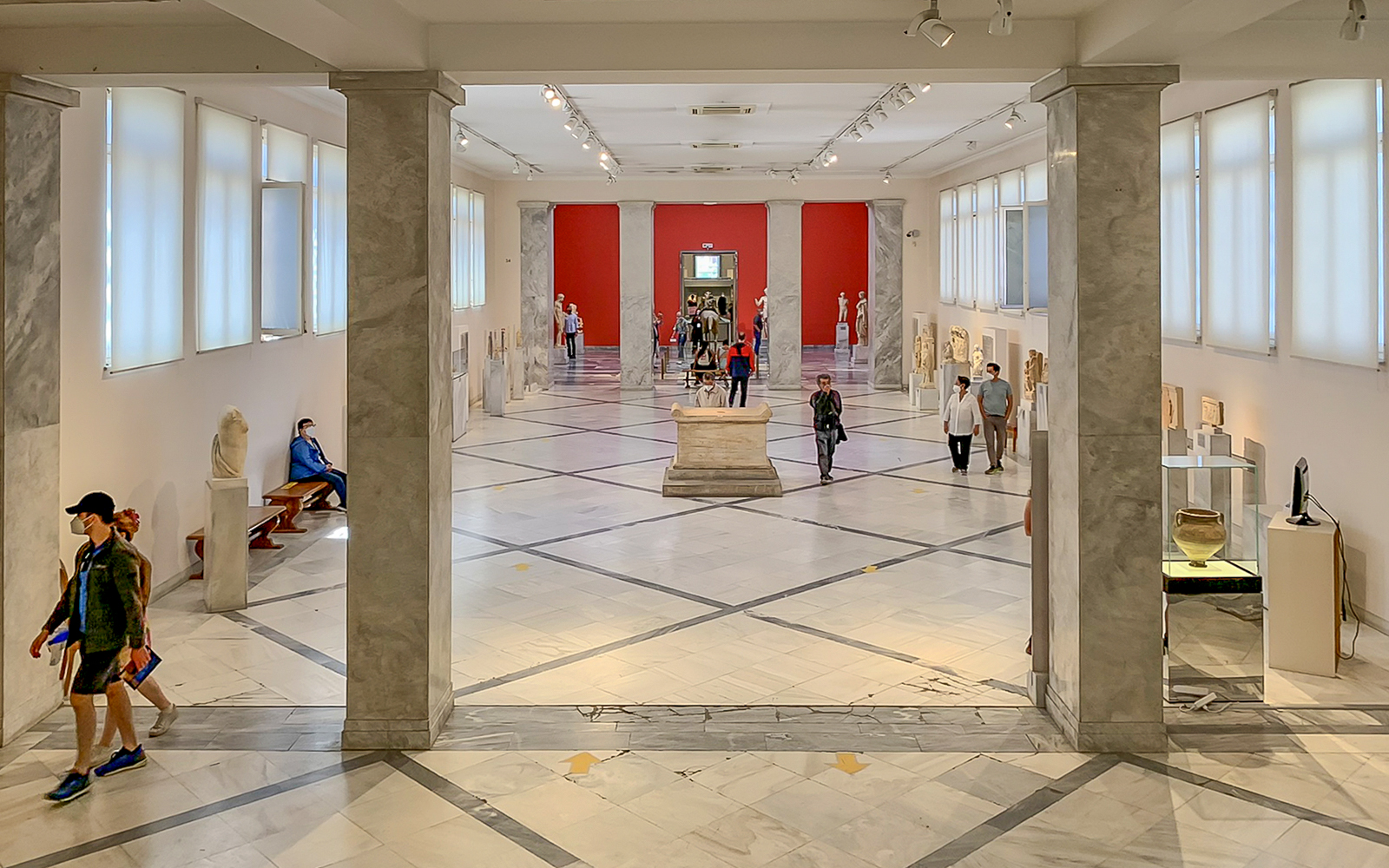 Exhibits and visitors inside the National Archaeological Museum, Athens.