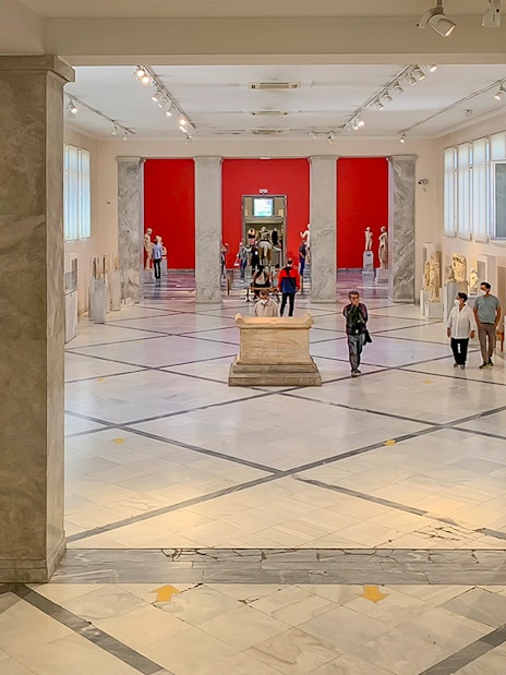Exhibits and visitors inside the National Archaeological Museum, Athens.