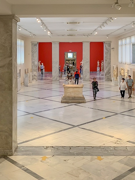 Exhibits and visitors inside the National Archaeological Museum, Athens.