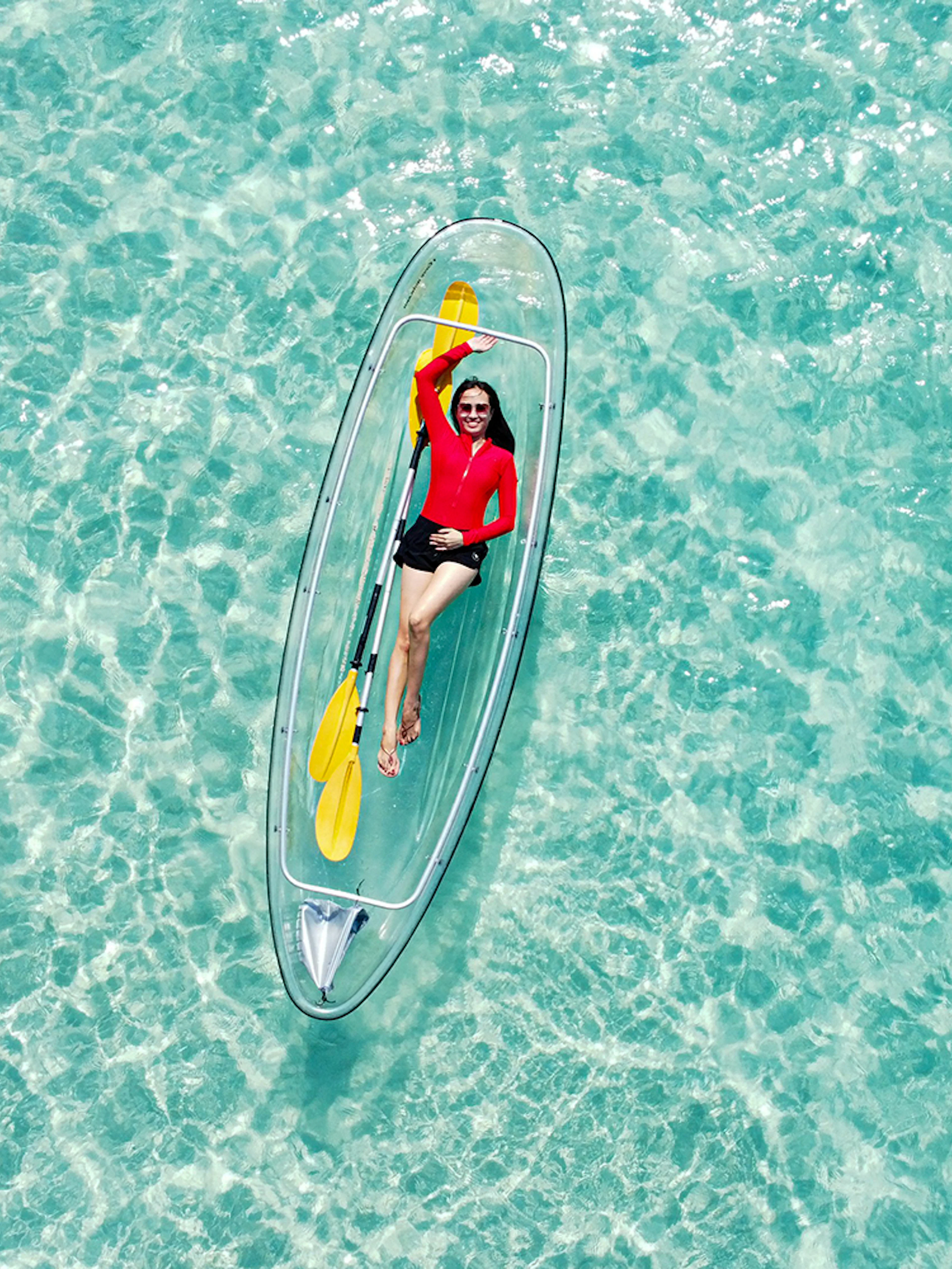 Kayaking on clear waters during Pattaya island day trip.
