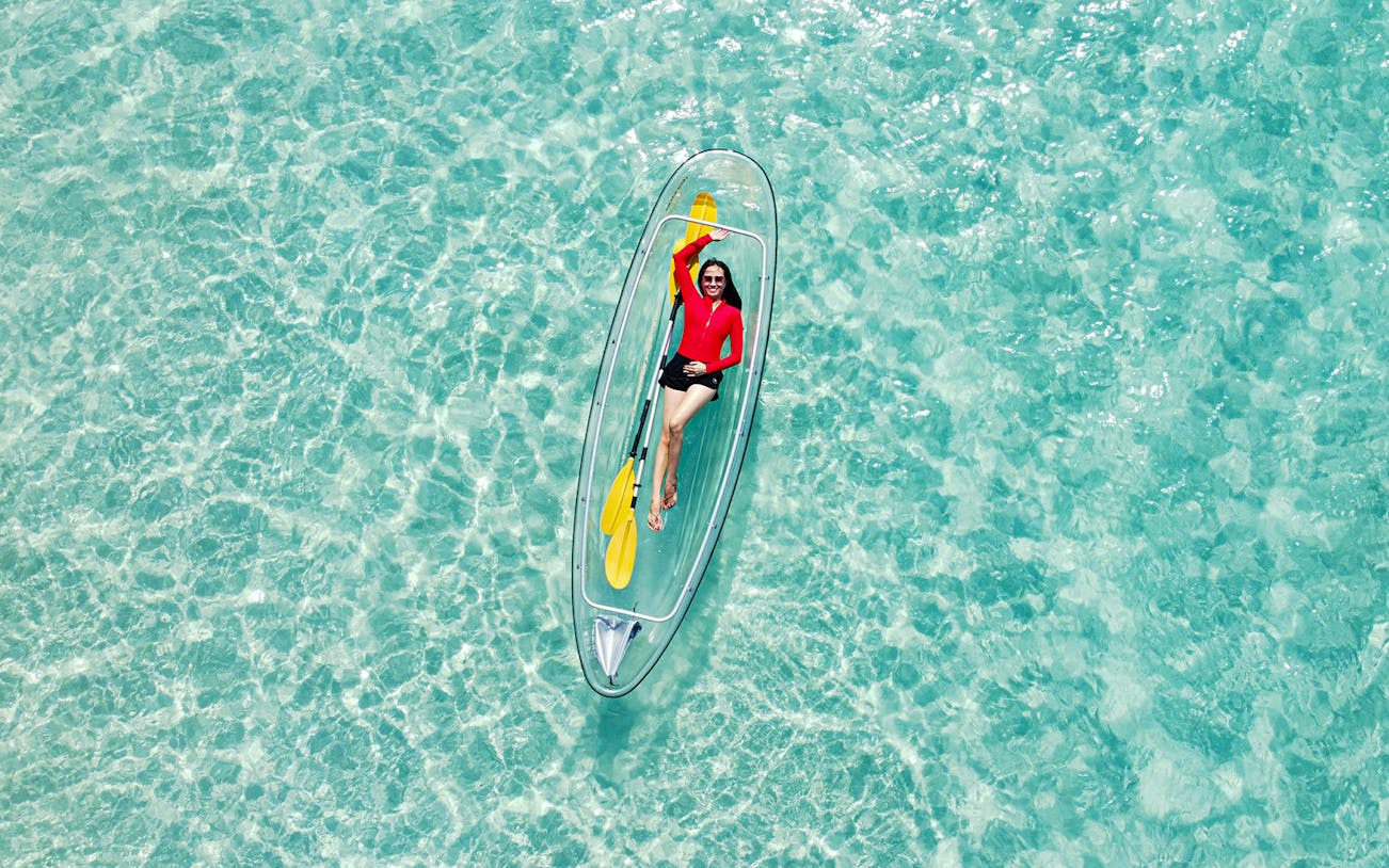 Kayaking on clear waters during Pattaya island day trip.