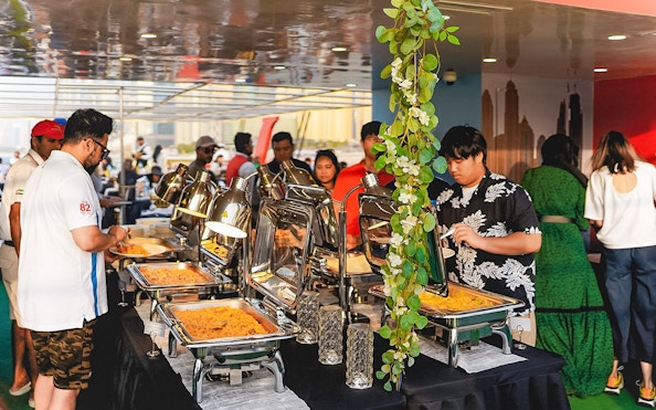 Buffet dinner setup on a sunset cruise in Dubai Marina.