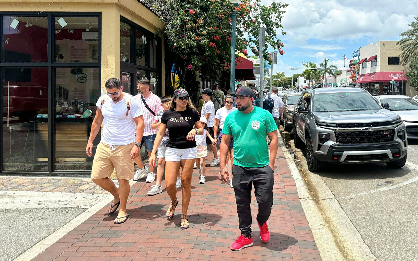 Guests exploring Miami city tour with iconic Art Deco architecture in the background.