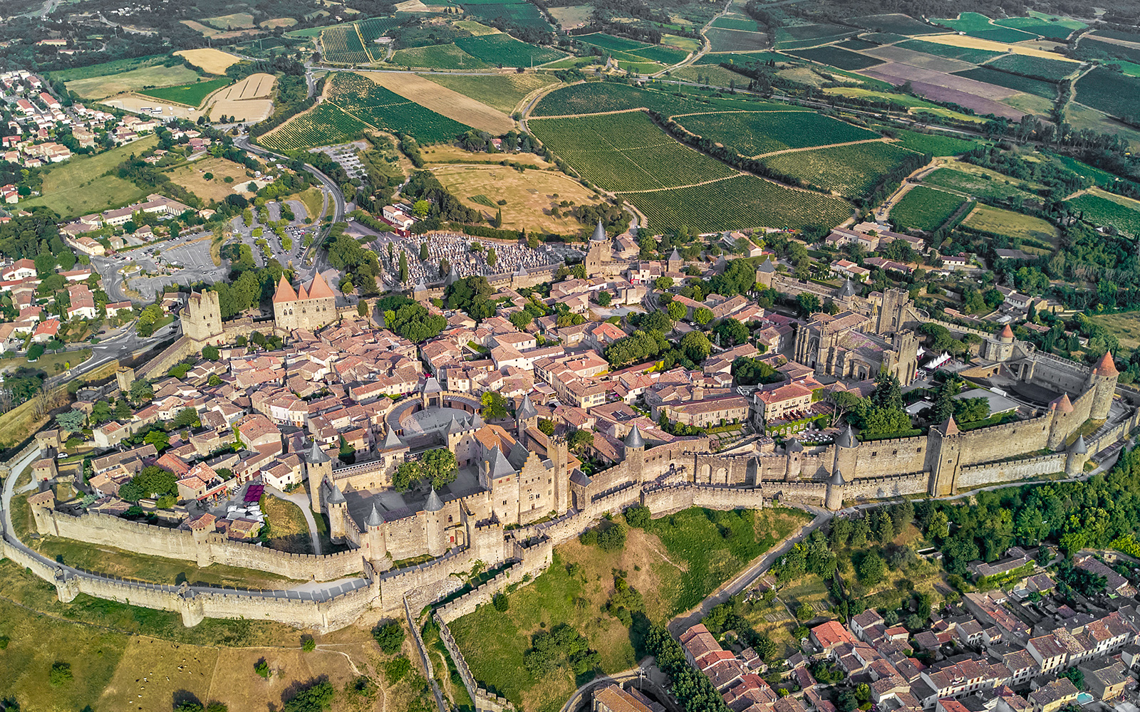 Aerial view of Carcassonne Castle and surrounding landscape in France.