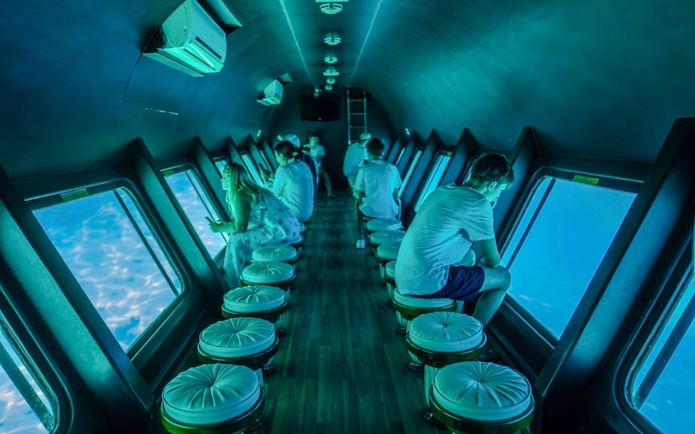 Tourists inside the Royal Seascope semi-submarine viewing the Red Sea, Hurghada.