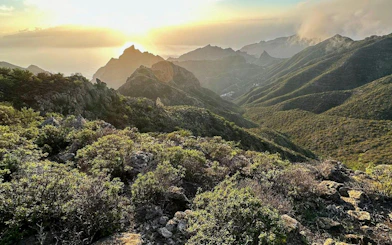 Sunset view over Masca Village and Teide National Park, Tenerife, with rugged mountain landscape.