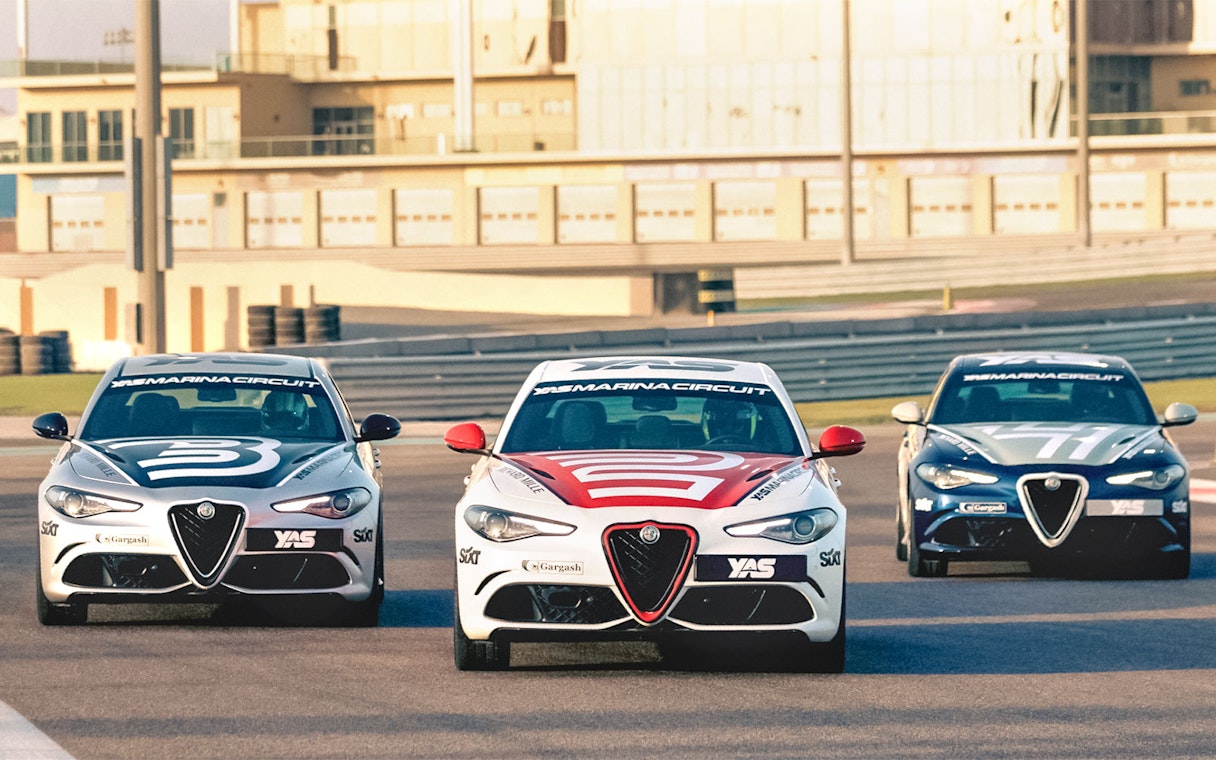 Alfa Romeo Giulia Quadrifoglio cars on track at Yas Marina Circuit.