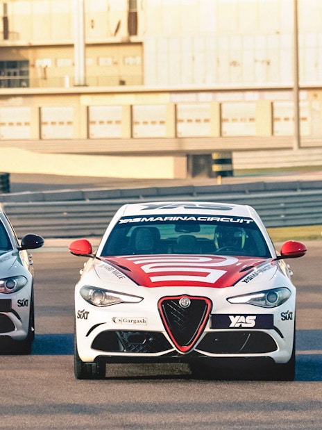 Alfa Romeo Giulia Quadrifoglio cars on track at Yas Marina Circuit.