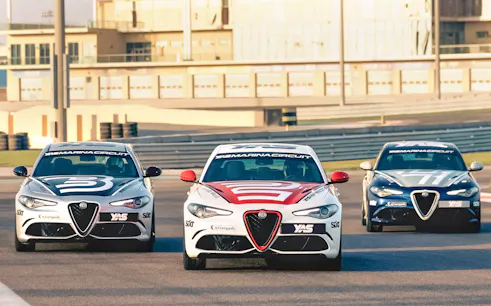 Alfa Romeo Giulia Quadrifoglio cars on track at Yas Marina Circuit.