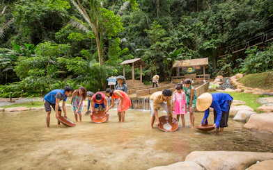Visitors panning for gold at Sunway Lagoon Theme Park, Malaysia.