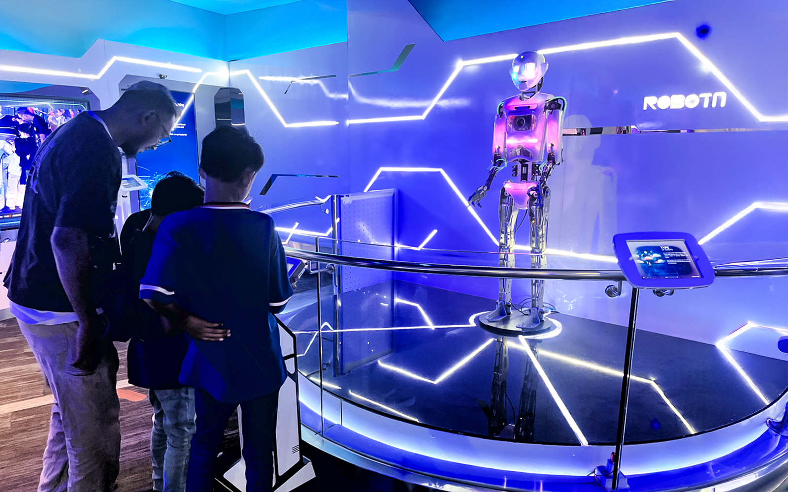 Visitors observing a robot exhibit at Petrosains, The Discovery Centre in Kuala Lumpur.
