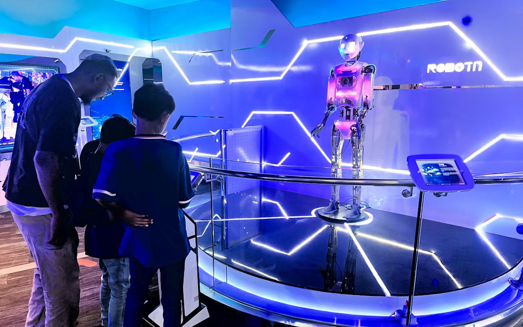 Visitors observing a robot exhibit at Petrosains, The Discovery Centre in Kuala Lumpur.