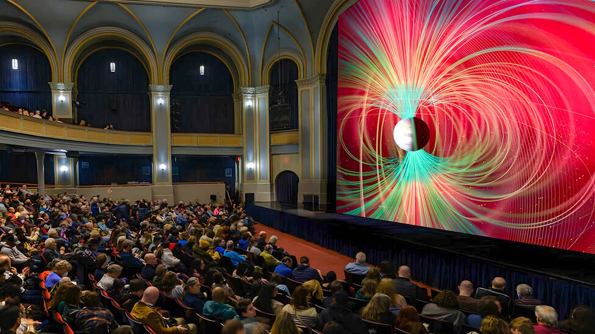 Audience watching Worlds Beyond Earth exhibit at American Museum of Natural History.