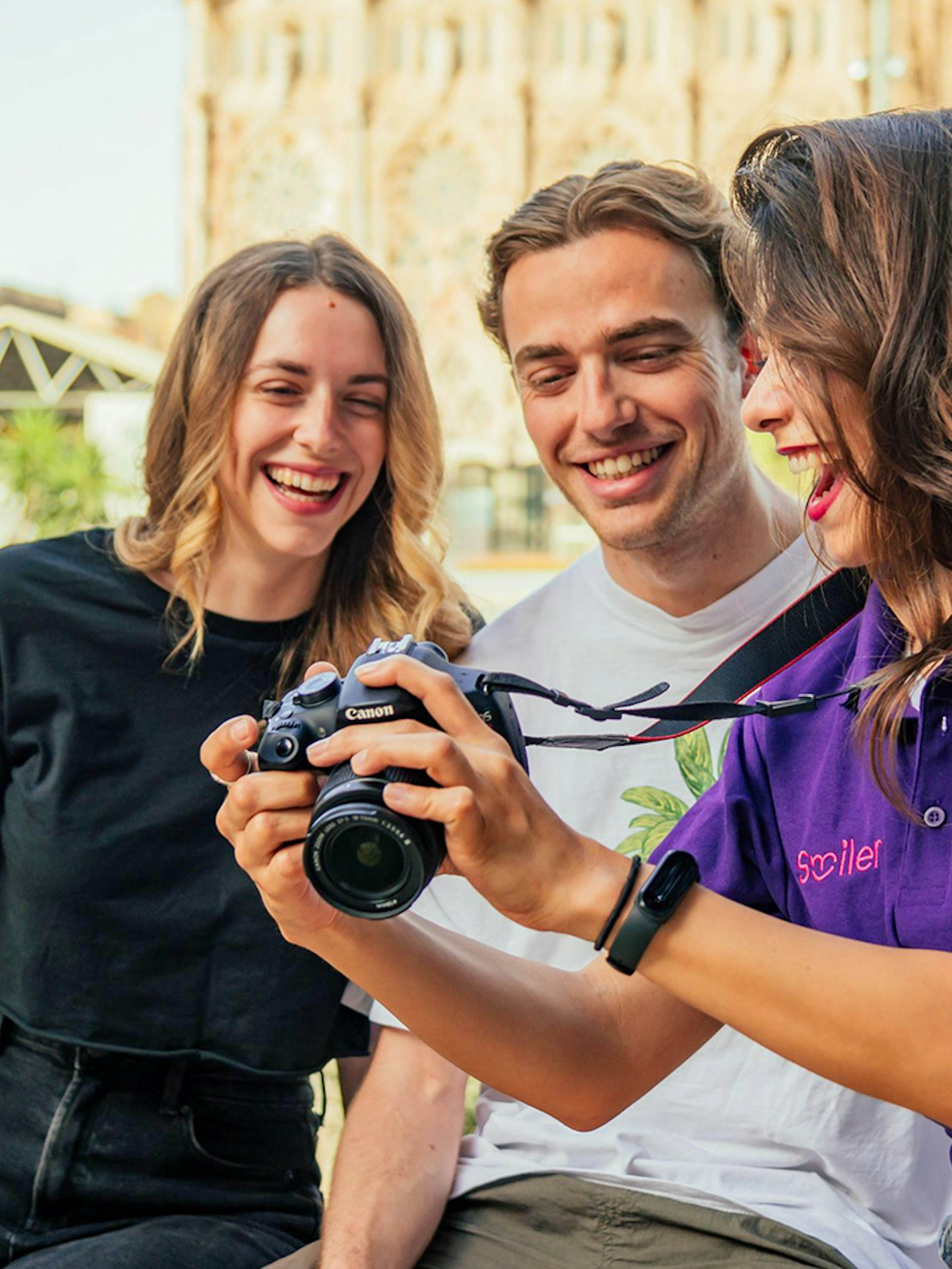 Group enjoying a professional photoshoot at Magere Brug, Amsterdam.