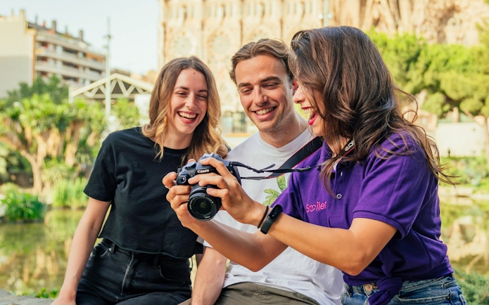 Group enjoying a professional photoshoot at Magere Brug, Amsterdam.