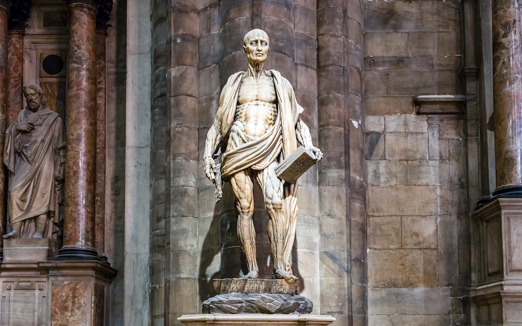 Intricate statue of Saint Bartholomew at Duomo Cathedral, Milan.