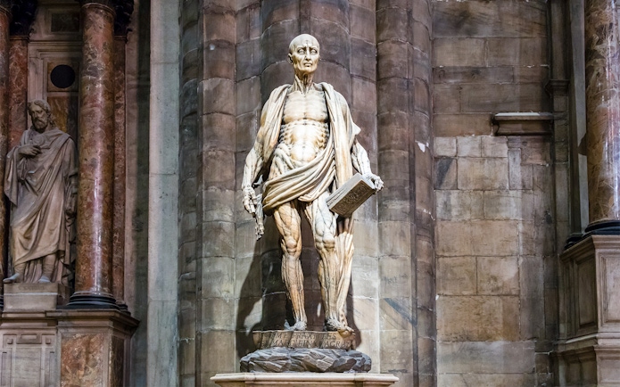 Intricate statue of Saint Bartholomew at Duomo Cathedral, Milan.