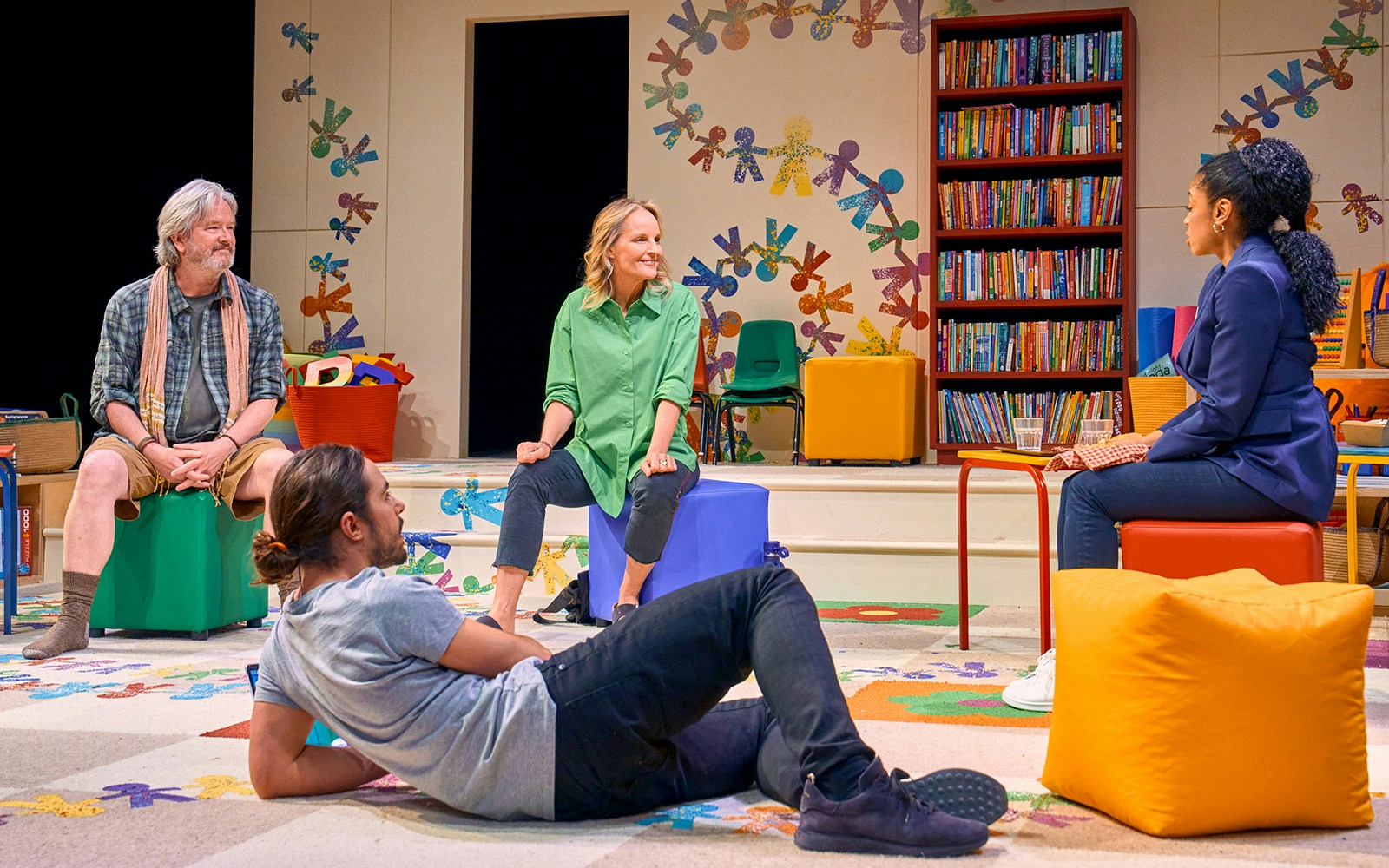 Group discussion in a colorful classroom setting during Eureka Day play.