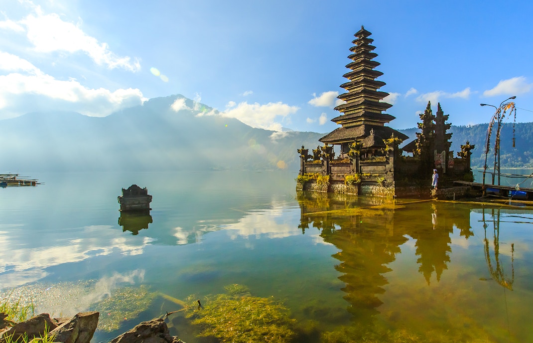 Temple on Lake Batur with mountain backdrop, Bali, Indonesia.