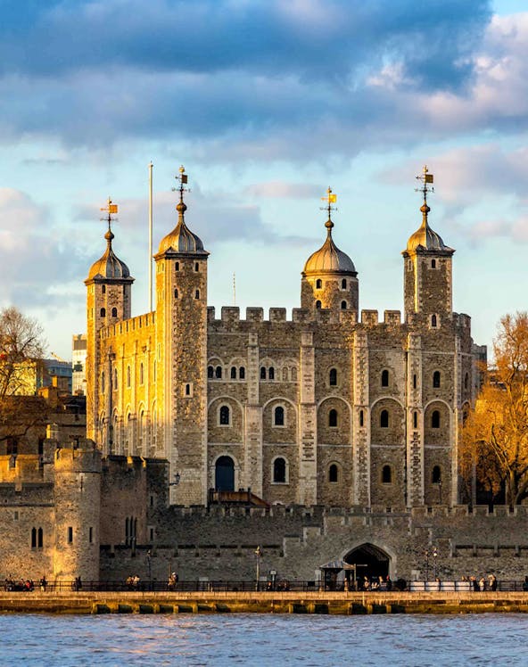 Tower of London with four turrets by the River Thames, England, UK.