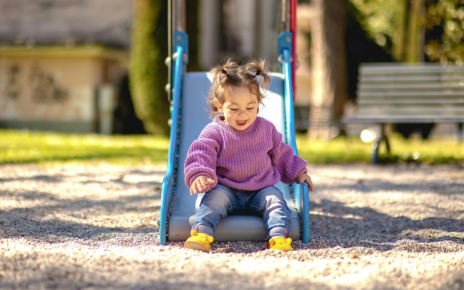 Children playing on playground equipment in Disneyland Park