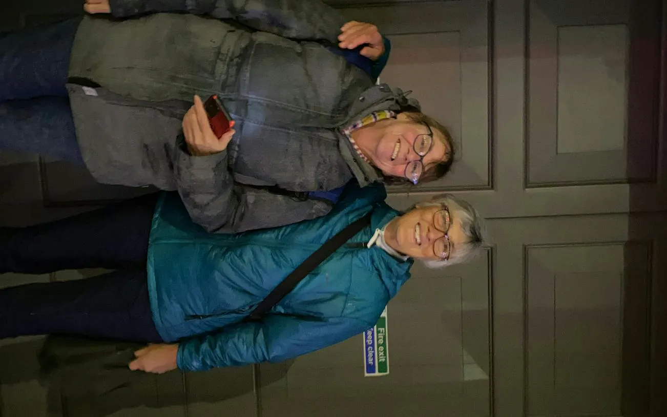 Two people smiling during the Edinburgh Secret Society Detective Mystery game.