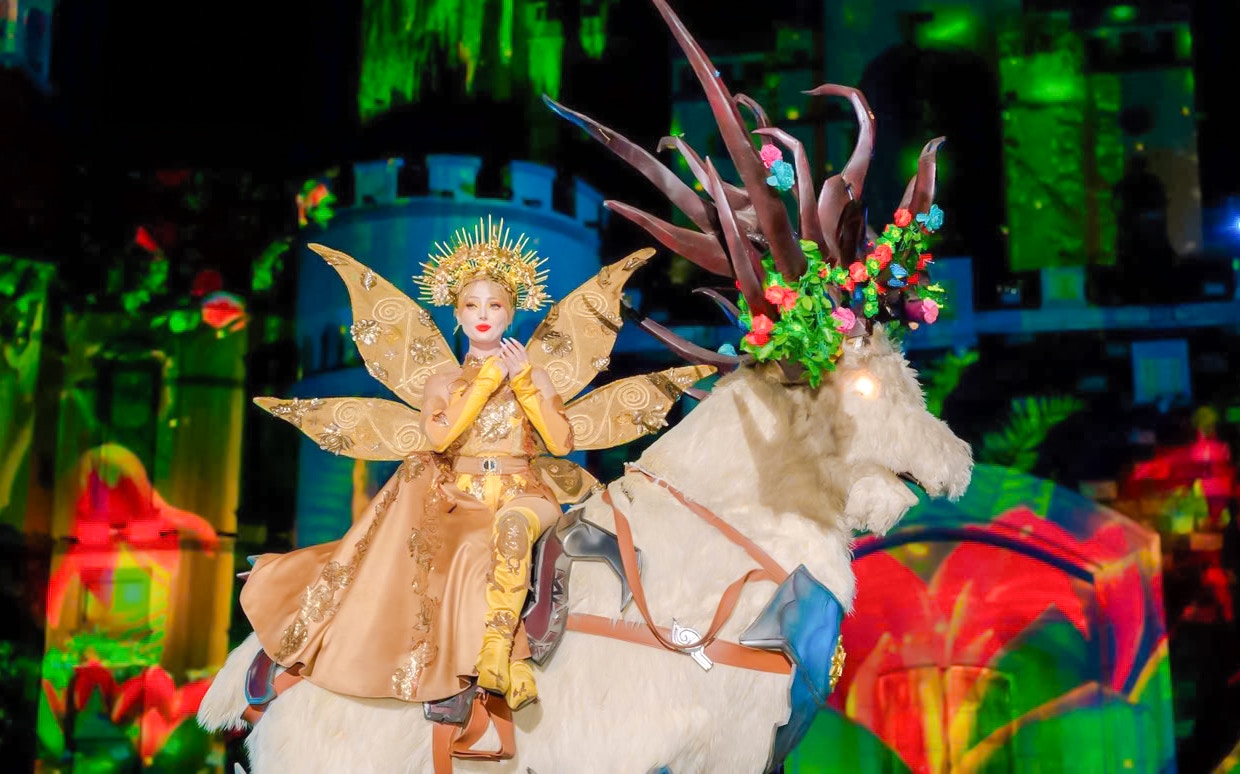 Princess character in golden costume on a mythical creature at Tata Show, Vinpearl, Nha Trang.