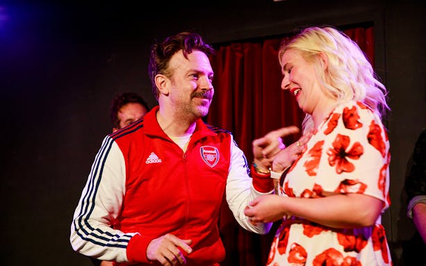 Performers interacting on stage at Boom Chicago Improv Comedy Show in Amsterdam.