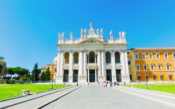 St. John Lateran Basilica facade in Rome with statues and columns.