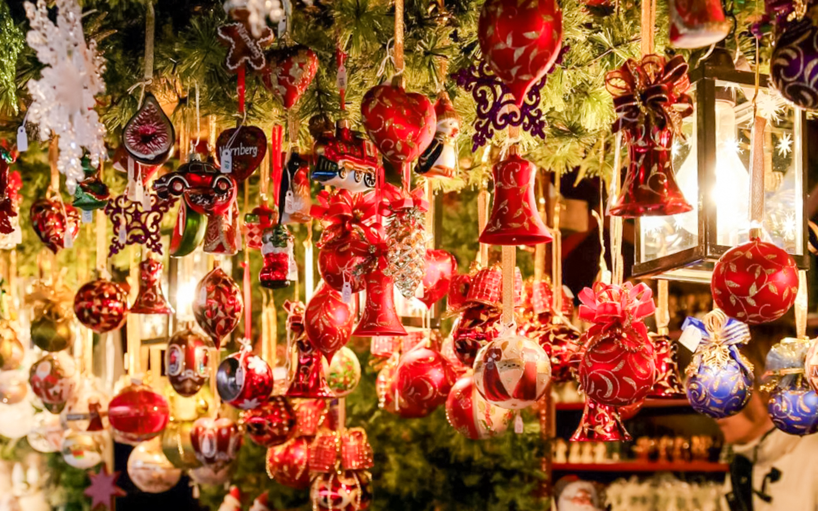 Szentendre Christmas Market ornaments hanging under festive lights.