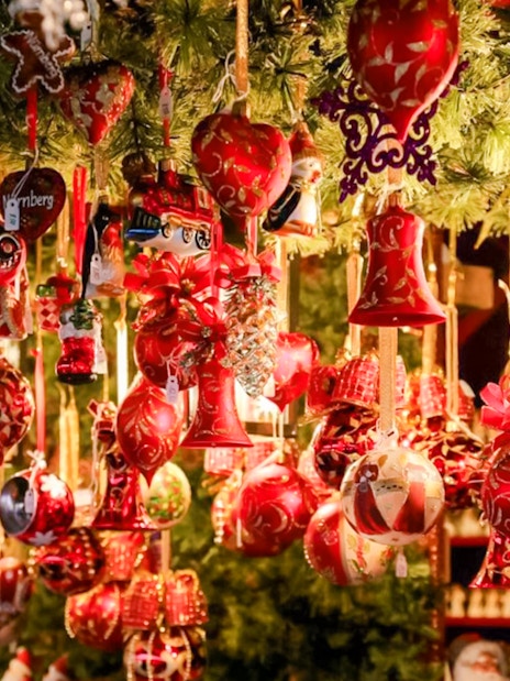 Szentendre Christmas Market ornaments hanging under festive lights.