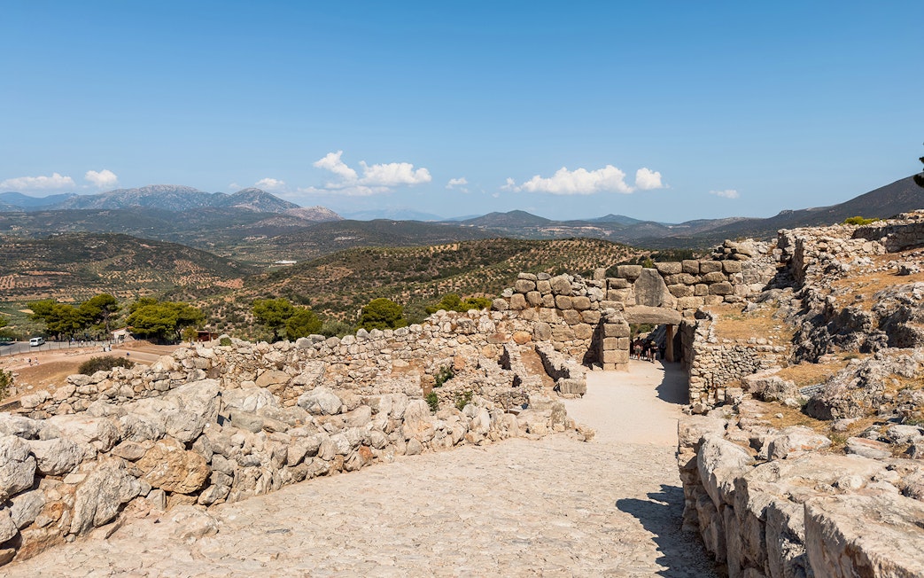 Ancient stone walls and Lion Gate at the archaeological site of Mycenae, Greece.