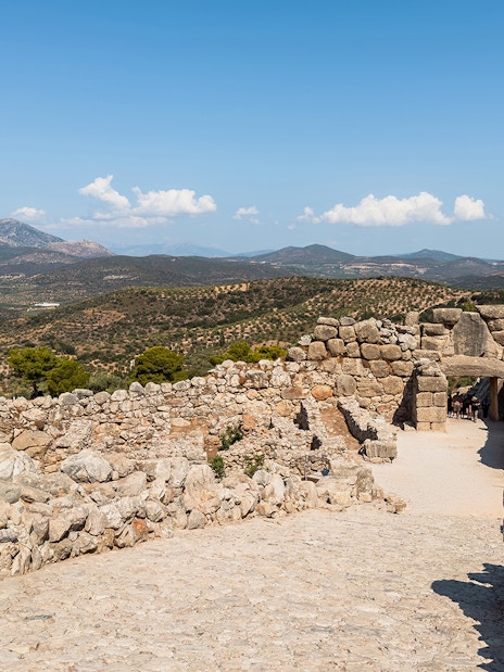 Ancient stone walls and Lion Gate at the archaeological site of Mycenae, Greece.