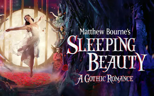 Dancer in white dress performing in front of a moonlit forest for Matthew Bourne's Sleeping Beauty.