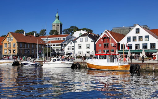Stavanger harbour with colorful buildings and boats during Fjord Sailing.