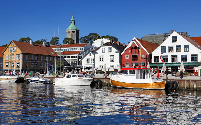 Stavanger harbour with colorful buildings and boats during Fjord Sailing.