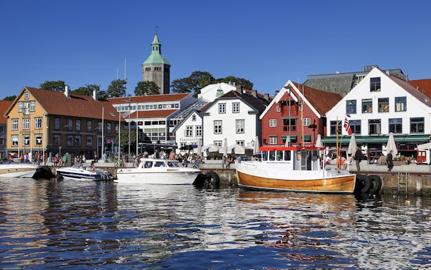 Stavanger harbour with colorful buildings and boats during Fjord Sailing.