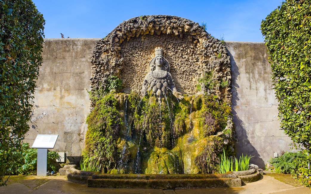 Villa d'Este Fountain with intricate stonework and lush greenery in Tivoli, Italy.