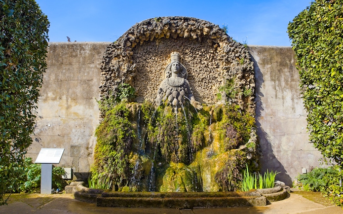 Villa d'Este Fountain with intricate stonework and lush greenery in Tivoli, Italy.