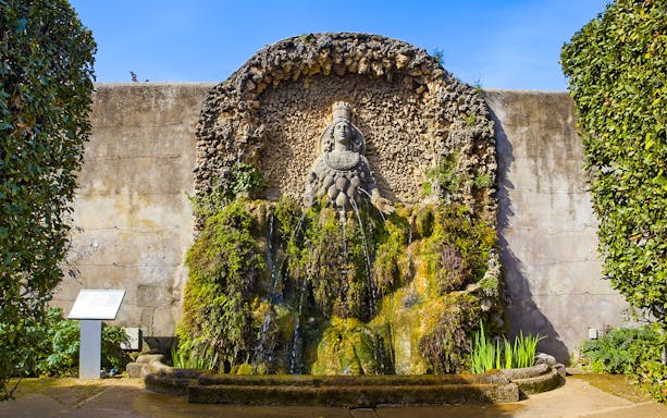 Villa d'Este Fountain with intricate stonework and lush greenery in Tivoli, Italy.