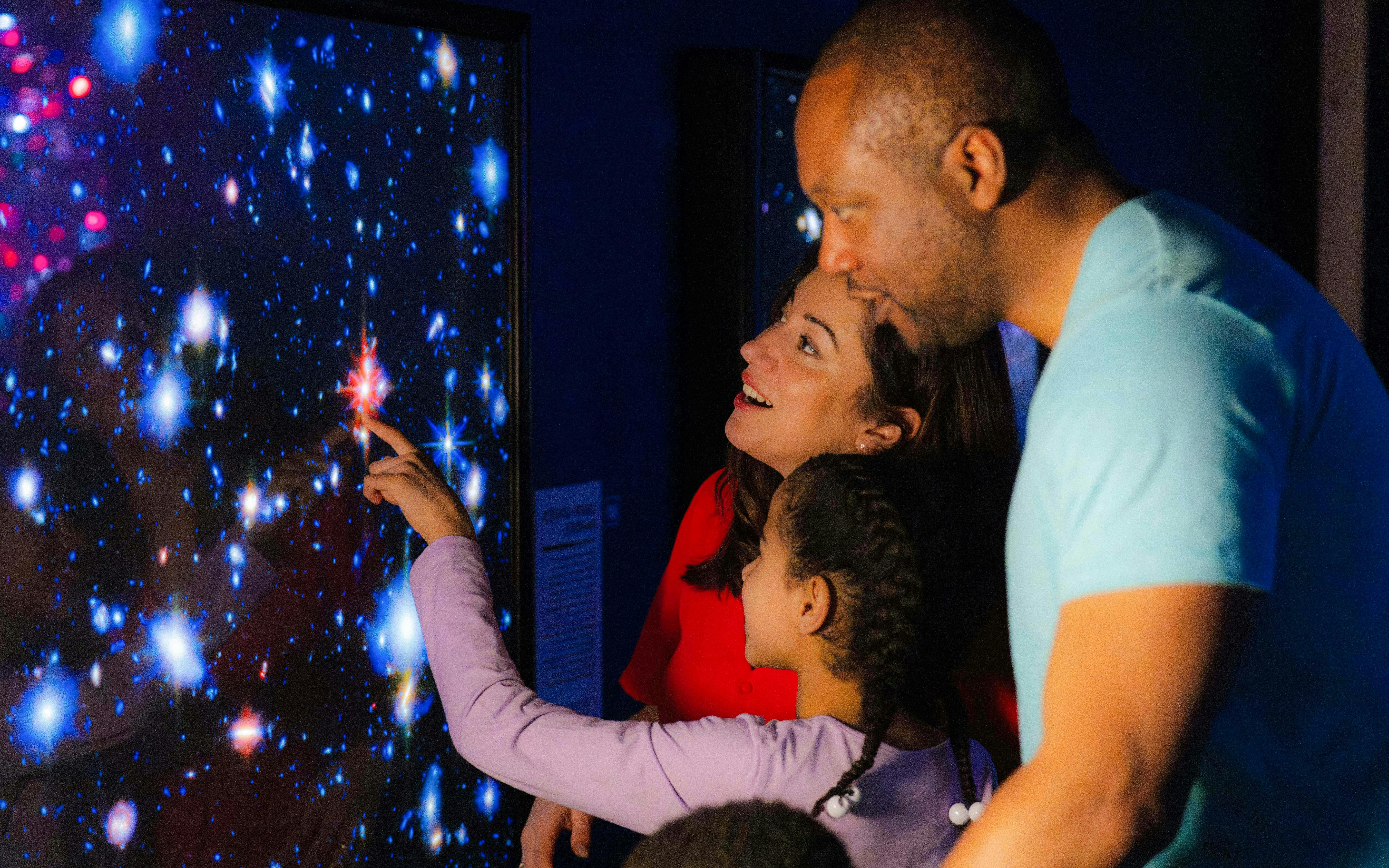 Guests exploring a starry display at the National Maritime Museum event.