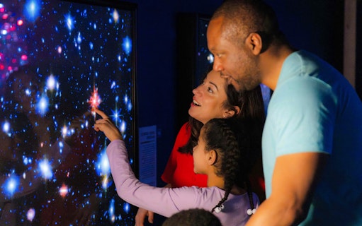 Guests exploring a starry display at the National Maritime Museum event.