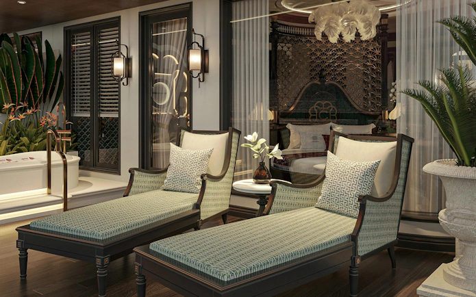 Luxurious suite interior on La Casta Star Cruise, Lan Ha Bay, featuring elegant lounge chairs and decor.